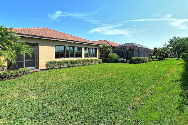 view of yard featuring glass enclosure