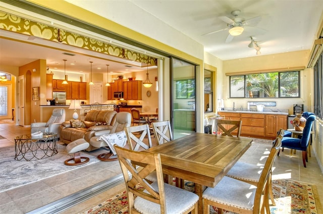 dining space featuring visible vents, ceiling fan, and light tile patterned floors