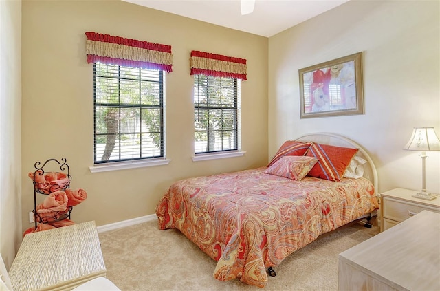 carpeted bedroom featuring baseboards