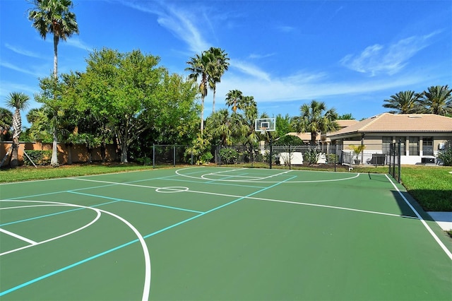 view of basketball court featuring community basketball court and fence