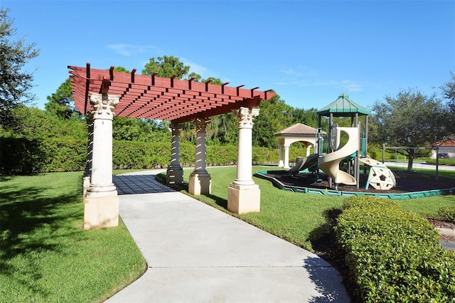 view of home's community featuring a playground, a pergola, and a lawn