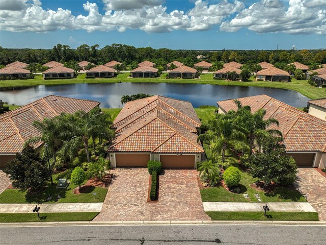 bird's eye view with a residential view and a water view