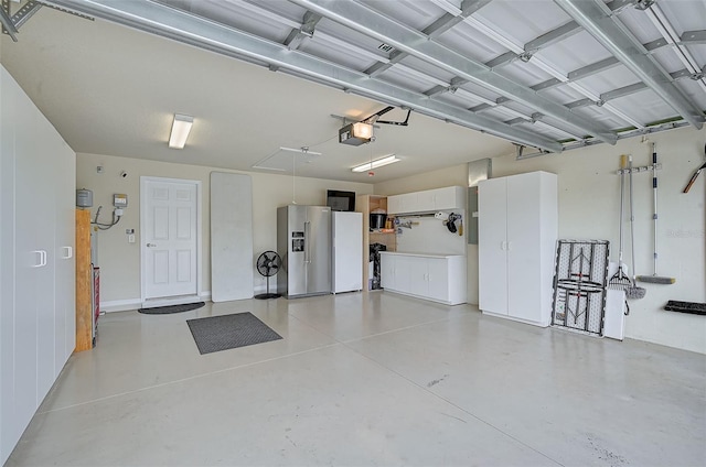 garage featuring high end fridge and a garage door opener