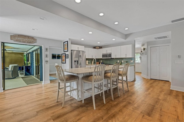 dining area with light hardwood / wood-style floors