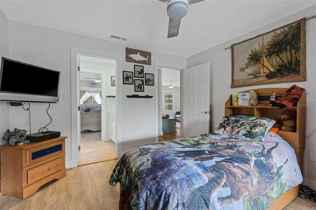 bedroom with connected bathroom and ceiling fan