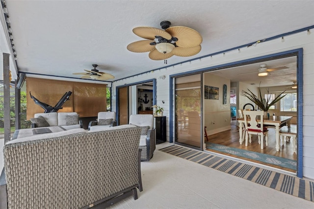 view of patio / terrace with an outdoor living space and ceiling fan