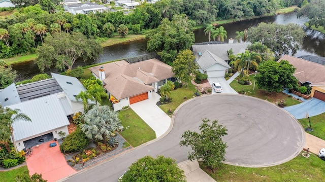 birds eye view of property with a water view