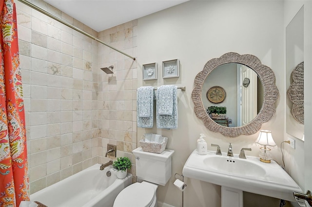 full bathroom featuring sink, shower / tub combo, and toilet