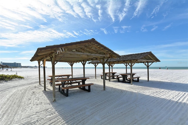 view of home's community with a gazebo and a water view