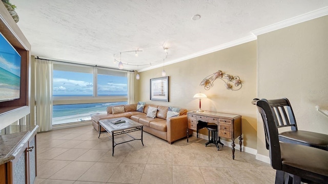 living area with a textured ceiling, baseboards, light tile patterned flooring, and crown molding