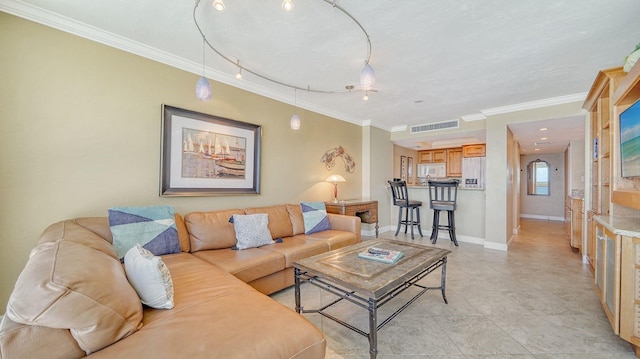 living area featuring baseboards, visible vents, crown molding, and light tile patterned flooring