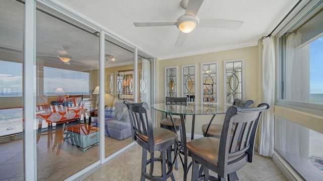 sunroom / solarium with a ceiling fan