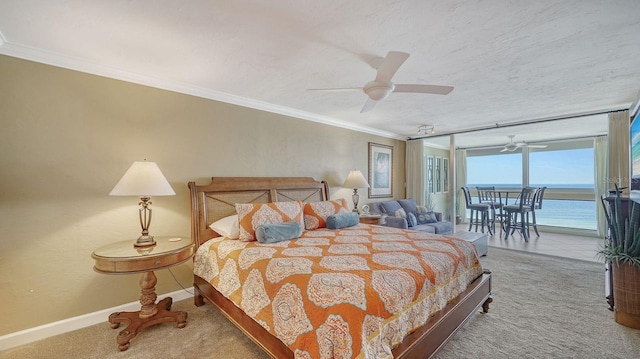 carpeted bedroom featuring baseboards, ceiling fan, access to outside, a textured ceiling, and crown molding