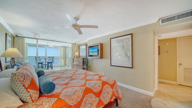 bedroom with access to exterior, visible vents, ornamental molding, and a textured ceiling