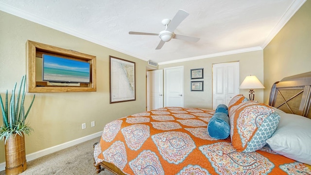 carpeted bedroom with ceiling fan, ornamental molding, and baseboards