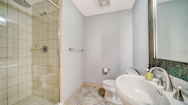 bathroom with walk in shower, tile patterned flooring, toilet, and sink