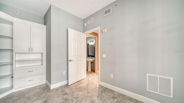 unfurnished bedroom with sink