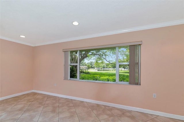 spare room featuring recessed lighting, crown molding, baseboards, and light tile patterned floors