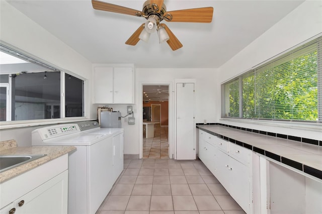 washroom with separate washer and dryer, a ceiling fan, and light tile patterned flooring