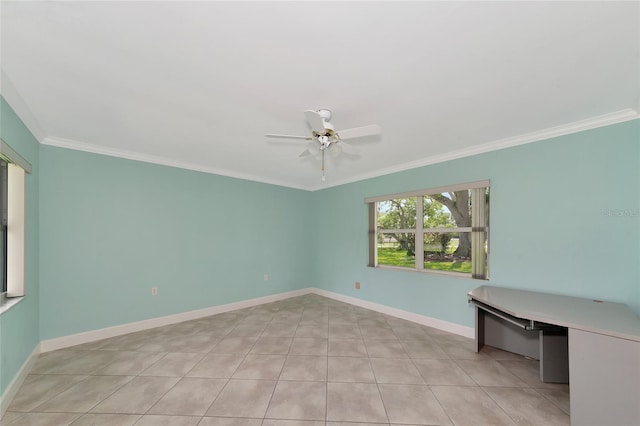 unfurnished room featuring a ceiling fan, light tile patterned floors, baseboards, and crown molding