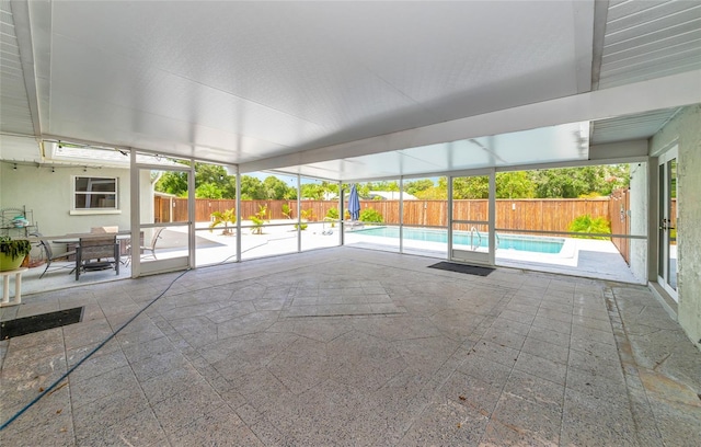 unfurnished sunroom featuring a wealth of natural light