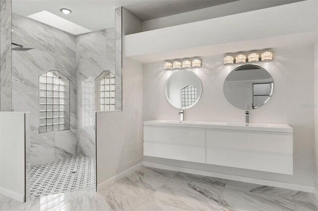 bathroom featuring vanity, a skylight, and tiled shower