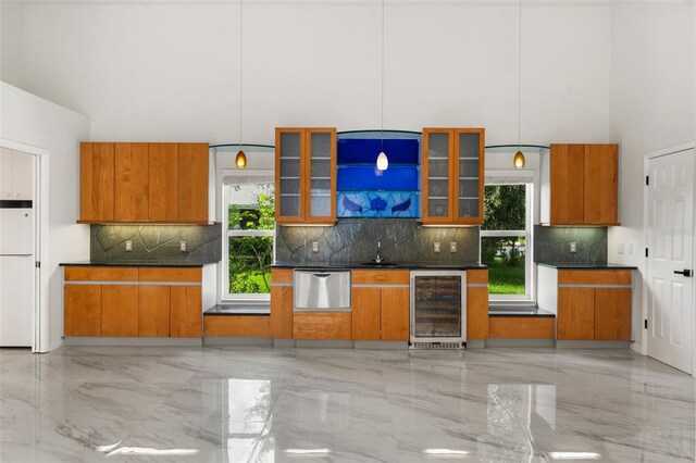 kitchen with pendant lighting, beverage cooler, dishwasher, and decorative backsplash