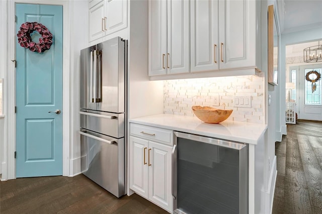 kitchen with dark hardwood / wood-style floors, beverage cooler, high end fridge, and white cabinets