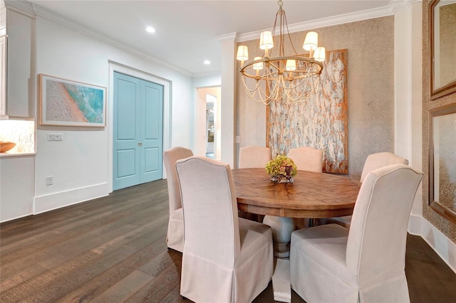 dining space featuring ornamental molding, dark wood-type flooring, and a chandelier