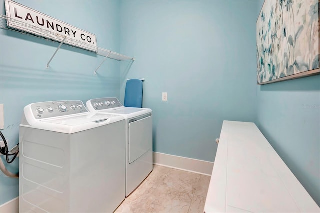 laundry area featuring washing machine and clothes dryer