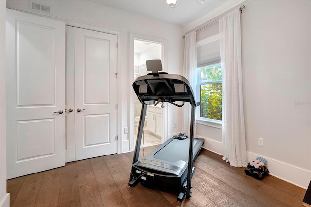 exercise area featuring hardwood / wood-style flooring