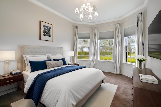 carpeted bedroom featuring crown molding and a chandelier