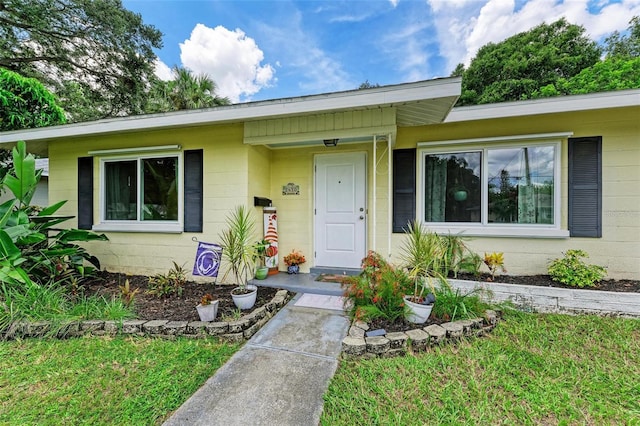 view of front of home featuring concrete block siding