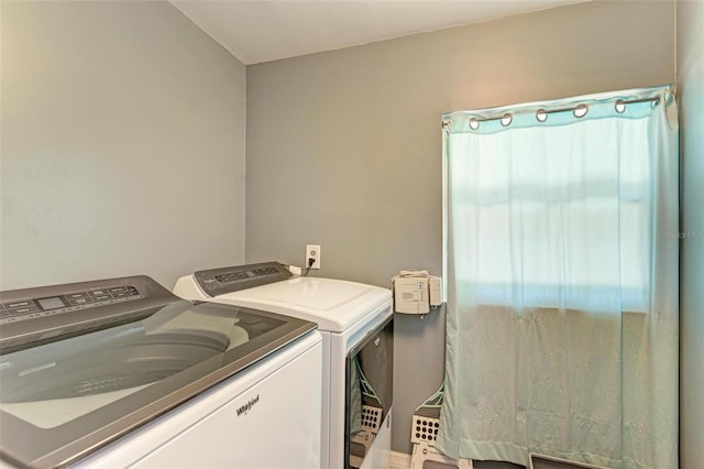 laundry room featuring laundry area and washer and clothes dryer