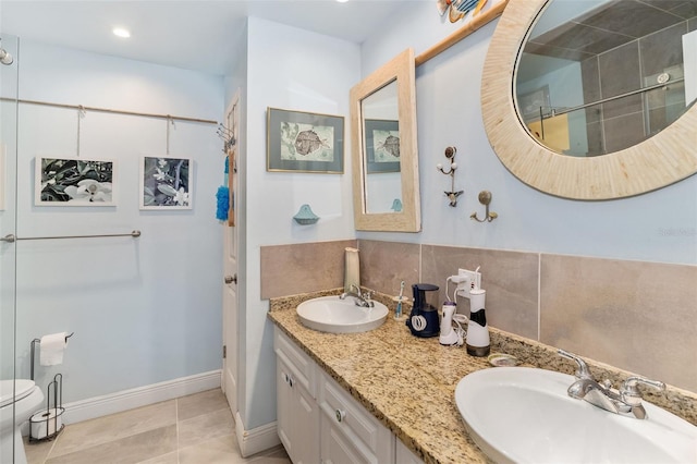 bathroom with vanity, toilet, and tile patterned flooring