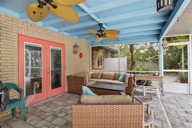 view of patio / terrace featuring an outdoor living space, ceiling fan, and french doors