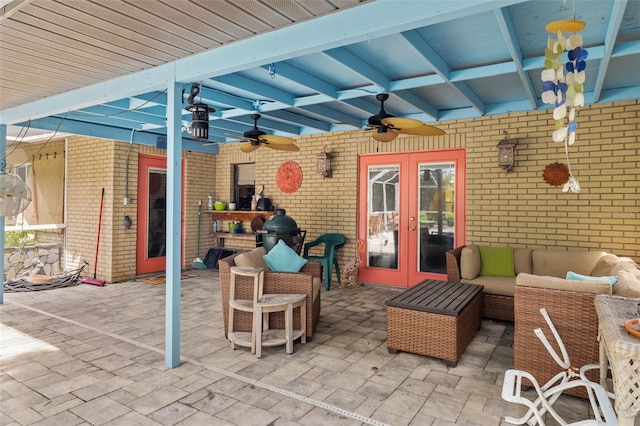 view of patio featuring ceiling fan, an outdoor hangout area, and french doors