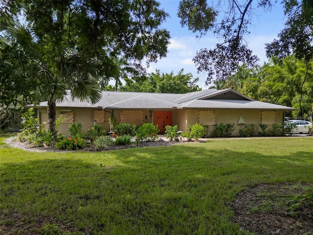 ranch-style house with a front lawn