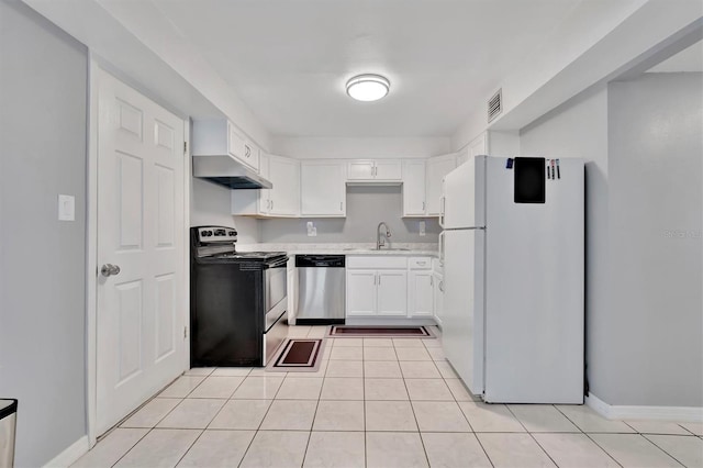 kitchen with appliances with stainless steel finishes, light tile patterned floors, sink, and white cabinets