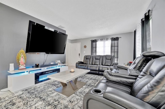 living room with a textured ceiling