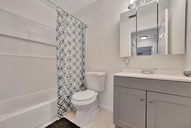 full bathroom featuring tile patterned floors, shower / bathtub combination with curtain, toilet, vanity, and a textured ceiling