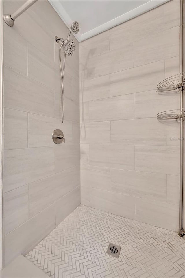 bathroom with a tile shower