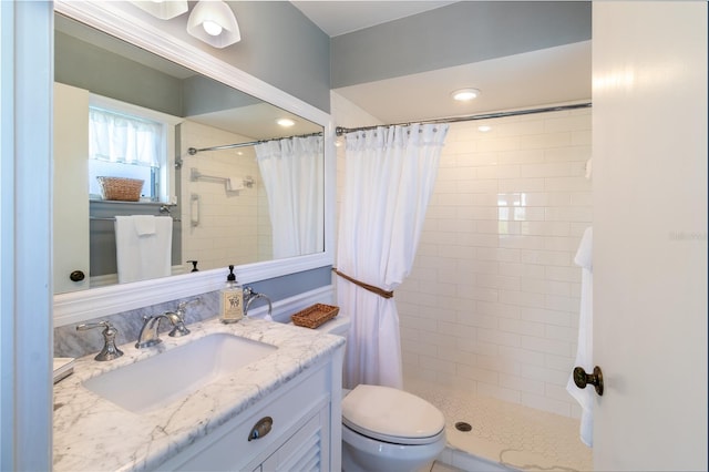 bathroom with vanity, toilet, and a shower with shower curtain