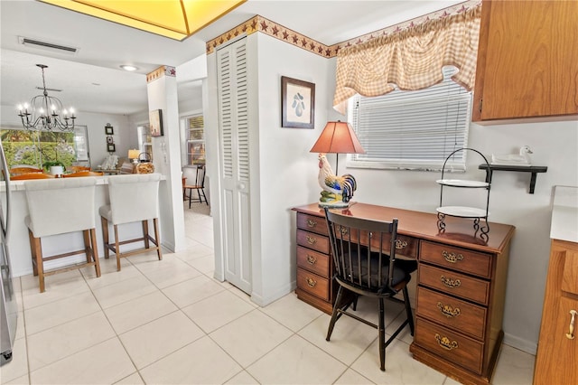 tiled office featuring a notable chandelier