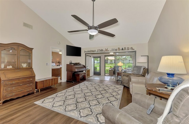 living room with high vaulted ceiling, wood-type flooring, and ceiling fan