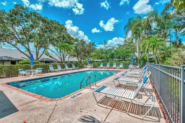 view of swimming pool with a patio area