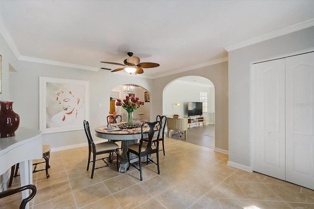 dining space featuring ceiling fan and crown molding