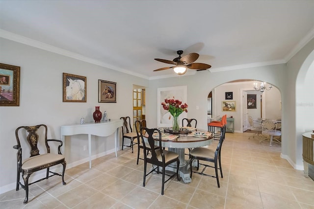 tiled dining room featuring ceiling fan with notable chandelier and crown molding