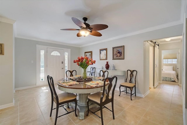 dining room with ornamental molding, light tile patterned floors, and ceiling fan