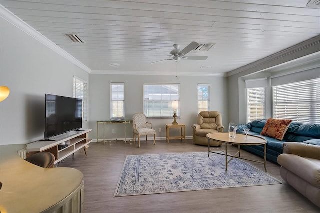 living room featuring ceiling fan, ornamental molding, and hardwood / wood-style floors